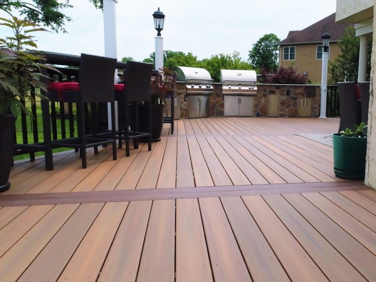 Composite deck with an outdoor bar and built-in grill
