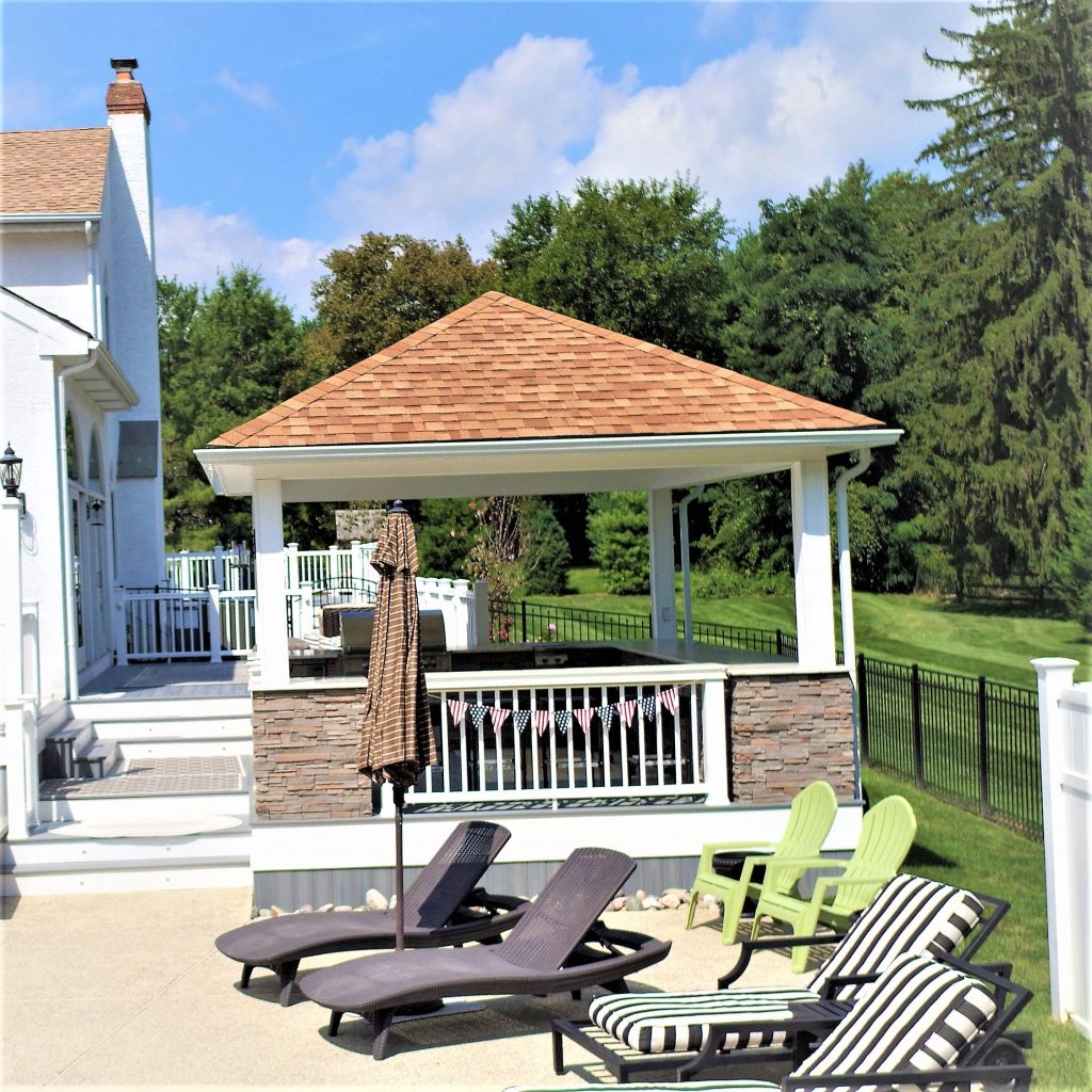 Gazebo on a deck overlooking a pool