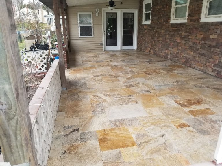 Natural flagstone patio under a covered porch