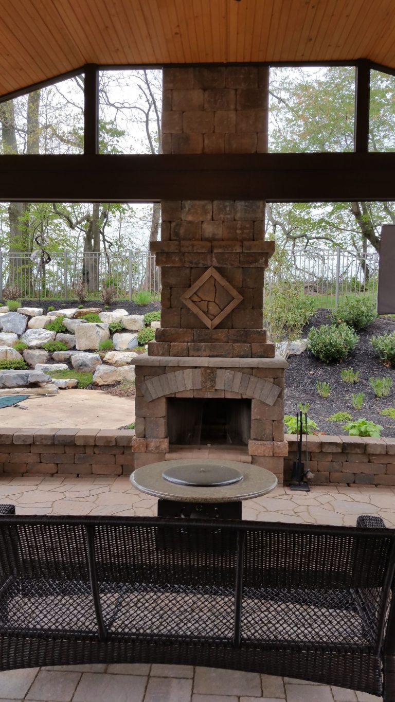 Stone fireplace framed by a timber roof structure