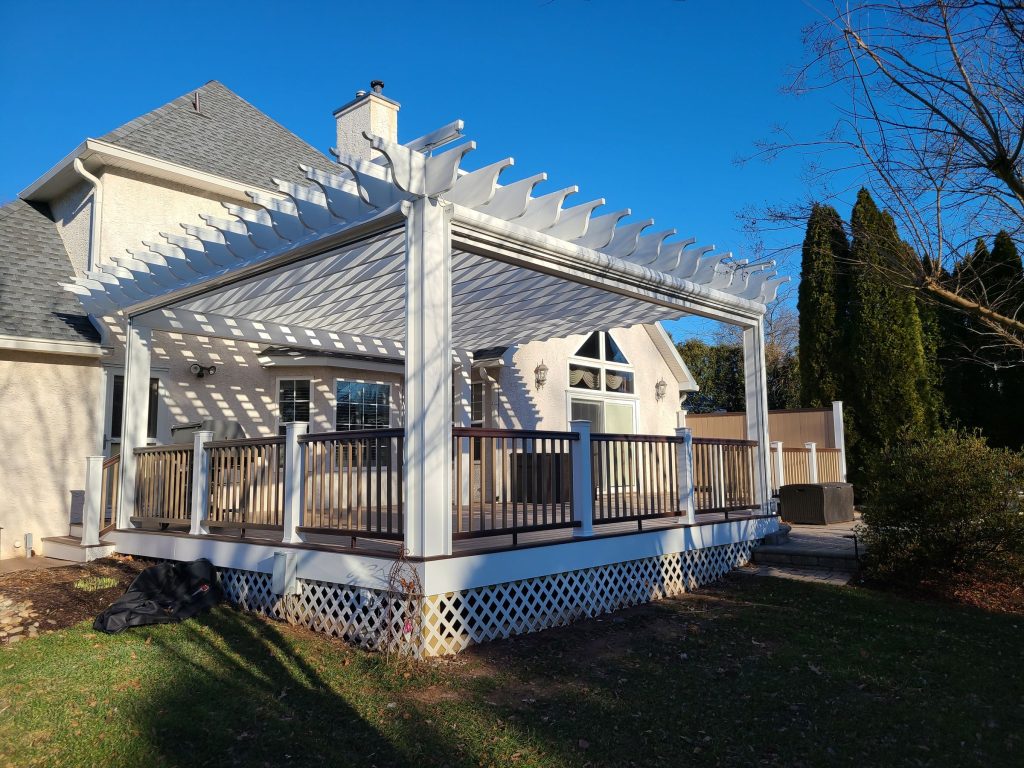 White pergola over a raised deck