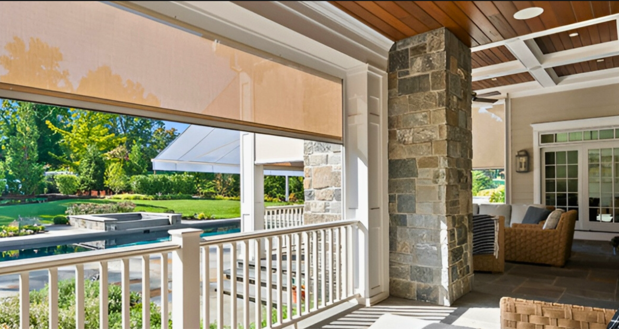 A riverside sheltered patio with a retractable screen partially lowered.